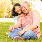 Couple sitting outside on the floor